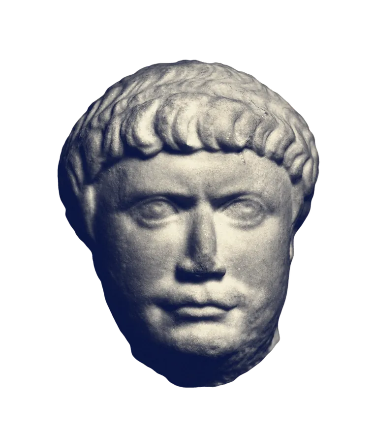 A marble head of the Roman emperor Trajan with a fringe of short hair